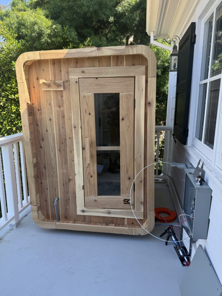 Outdoor sauna shed installation with new 220V 30A power line and controller wiring in Brentwood Los Angeles.”